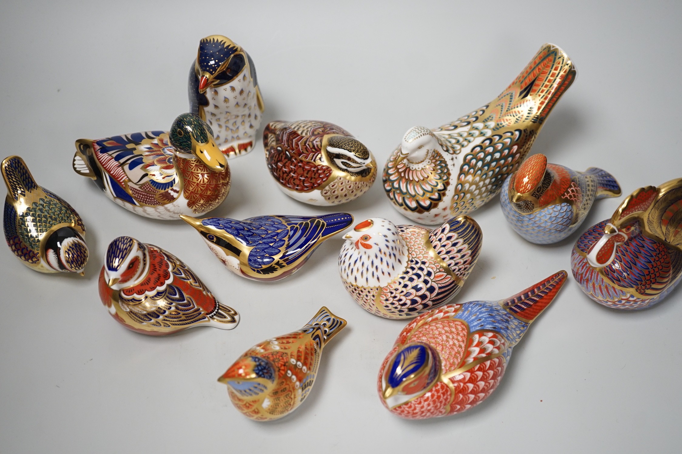 Twelve Royal Crown Derby ‘bird’ paperweights